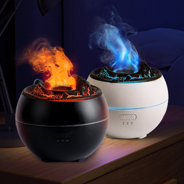 Two spherical devices, one with flames and the other with blue smoke, on a dark surface.