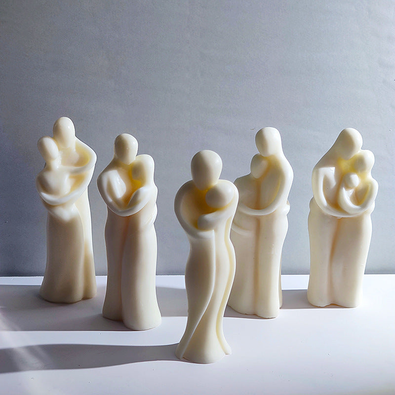 Set of five white ceramic figurines on a gray background