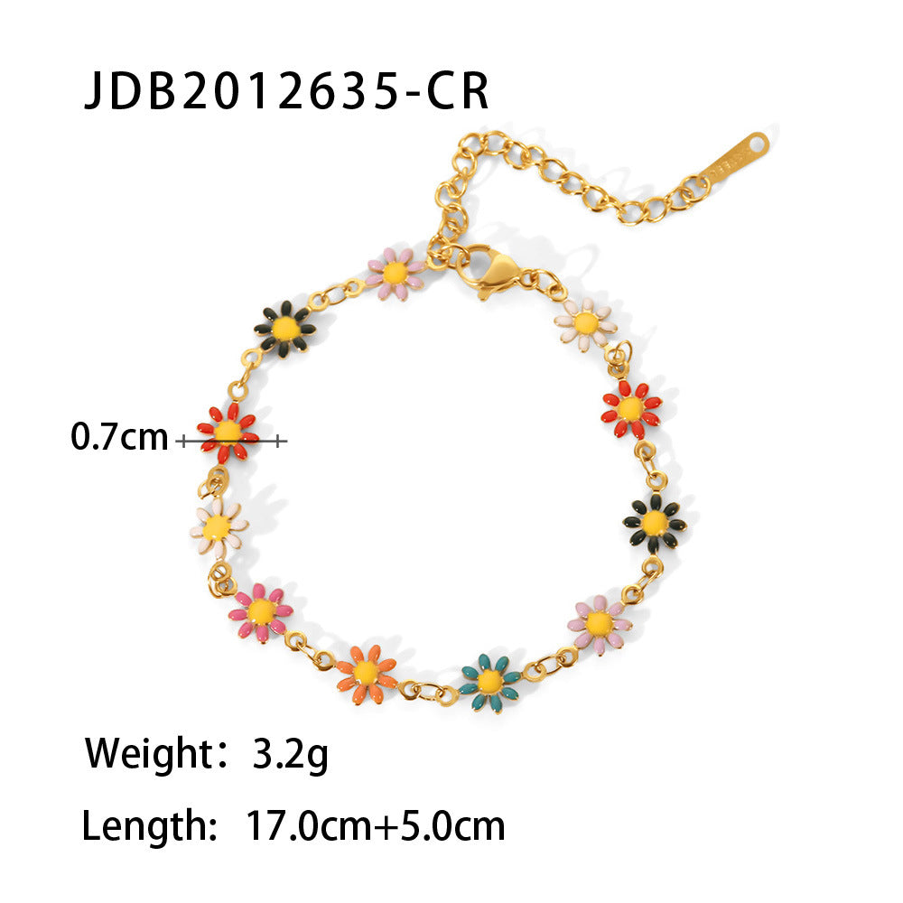 Bracelet with colorful flower-shaped charms on a white background