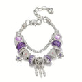 Silver bracelet with purple beads and charms on a white background