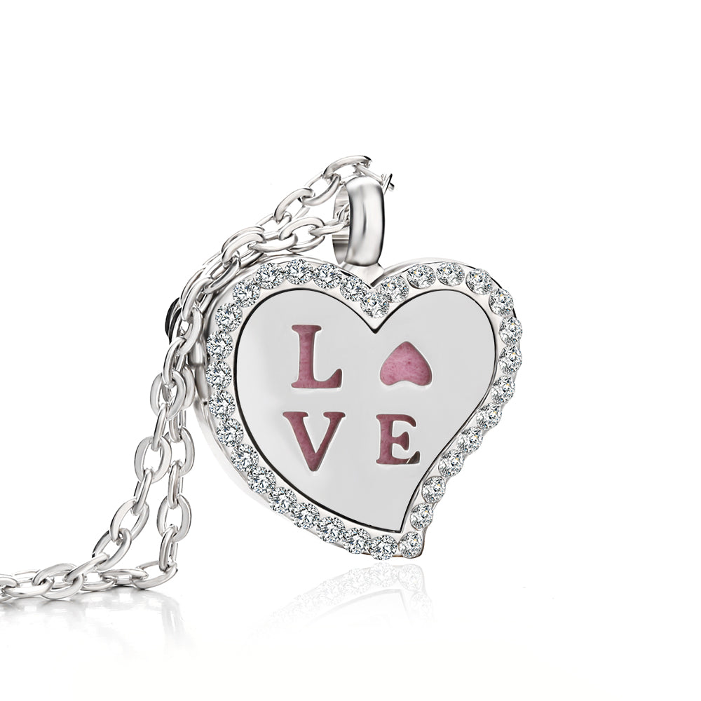 Heart-shaped pendant with 'LOVE' engraving on a white background