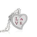 Heart-shaped pendant with 'LOVE' engraving on a white background