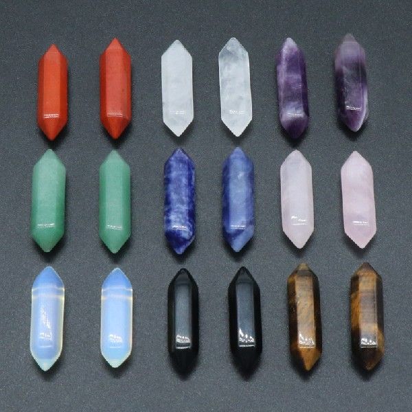 Collection of various crystal points on a dark background