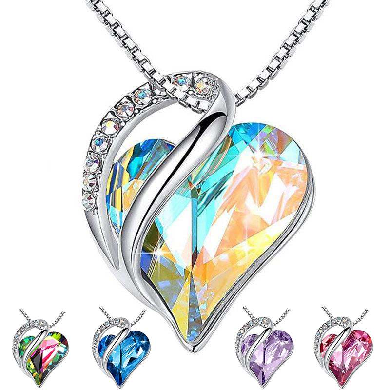 Heart-shaped crystal pendant necklace with colorful heart-shaped pendants on a white background