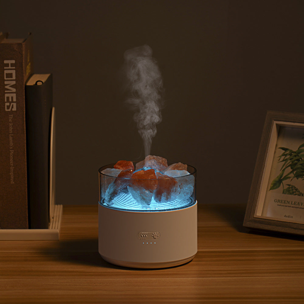Smoky diffuser on a wooden surface with books and a picture frame in the background