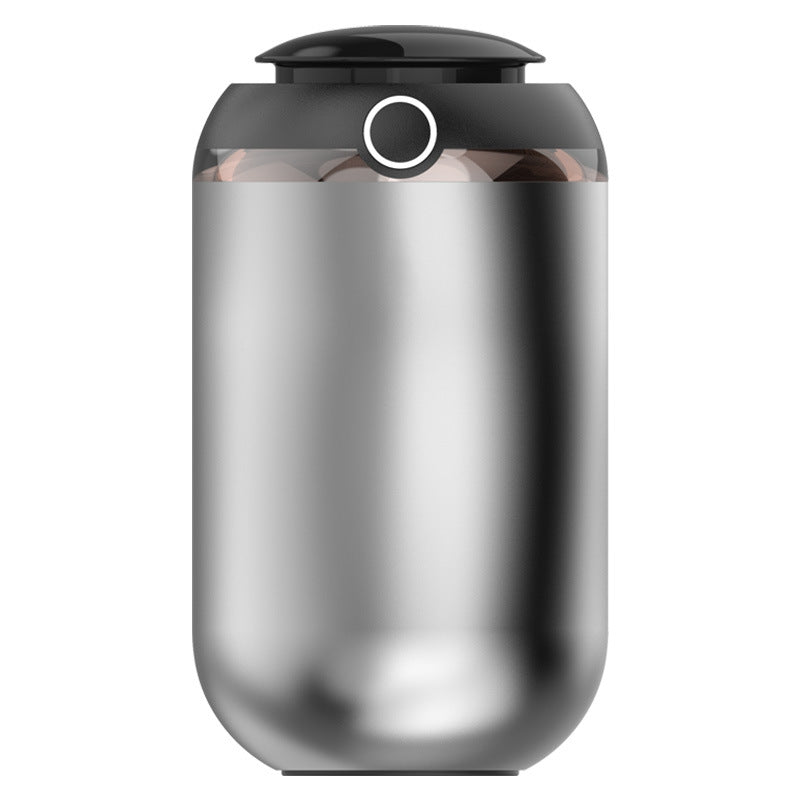 Silver and black cylindrical device on a white background