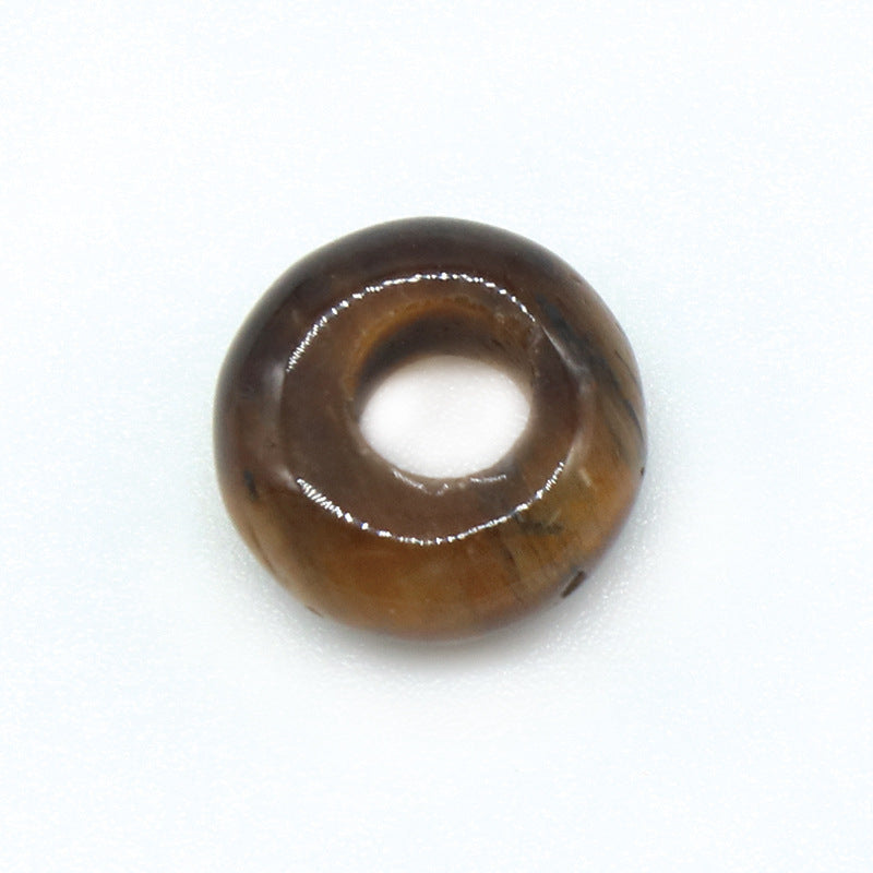 Brown donut-shaped object on a white background