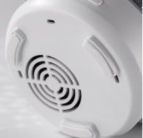 White smoke detector on a white background