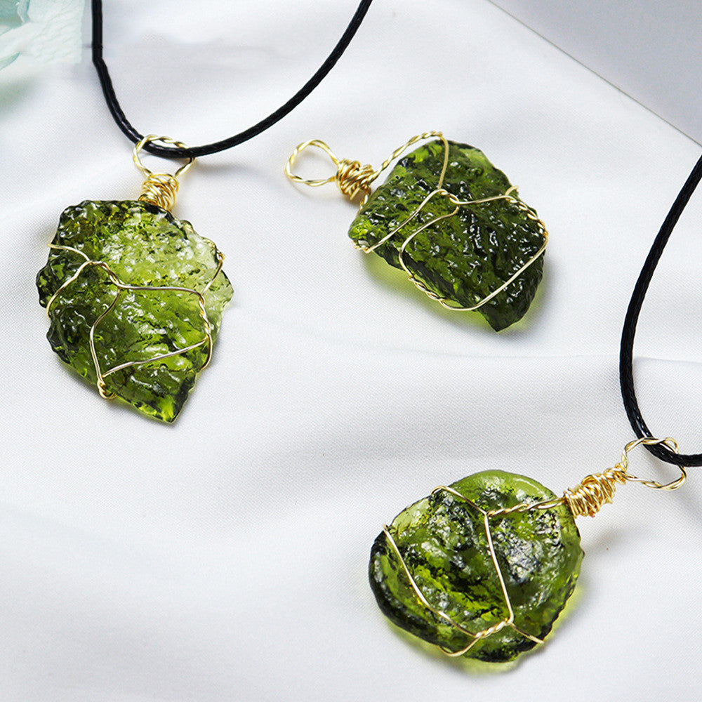 Three green stone necklaces with gold wire wrapping on a white background