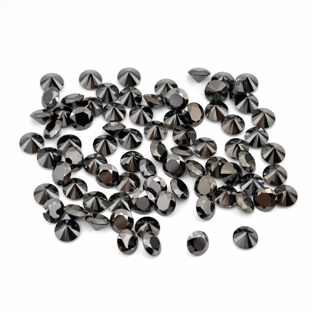Collection of black diamond stones on a white background