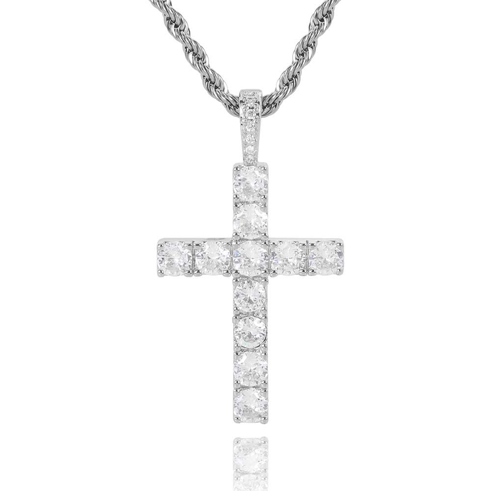 Diamond cross pendant on a chain against a white background