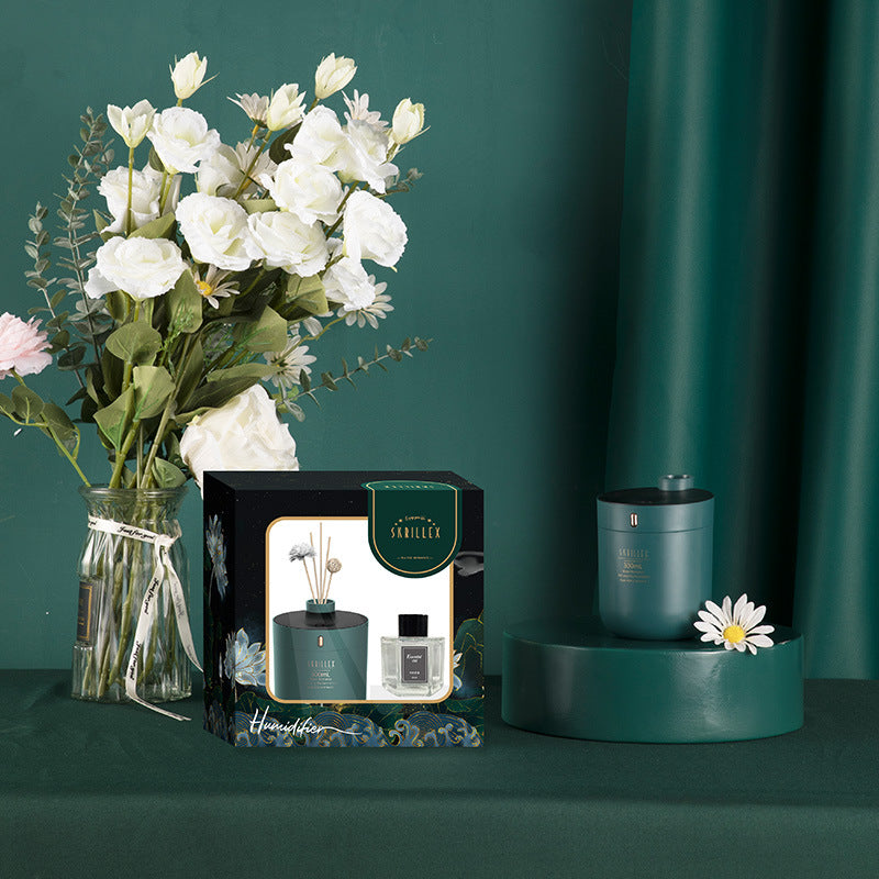 Decorative set with flowers, candles, and a box on a green background