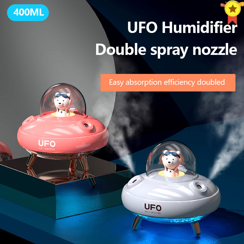 UFO humidifier with double spray nozzle on a dark background