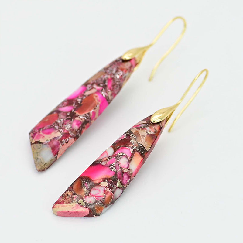 Colorful teardrop-shaped earrings with gold hooks on a light gray background