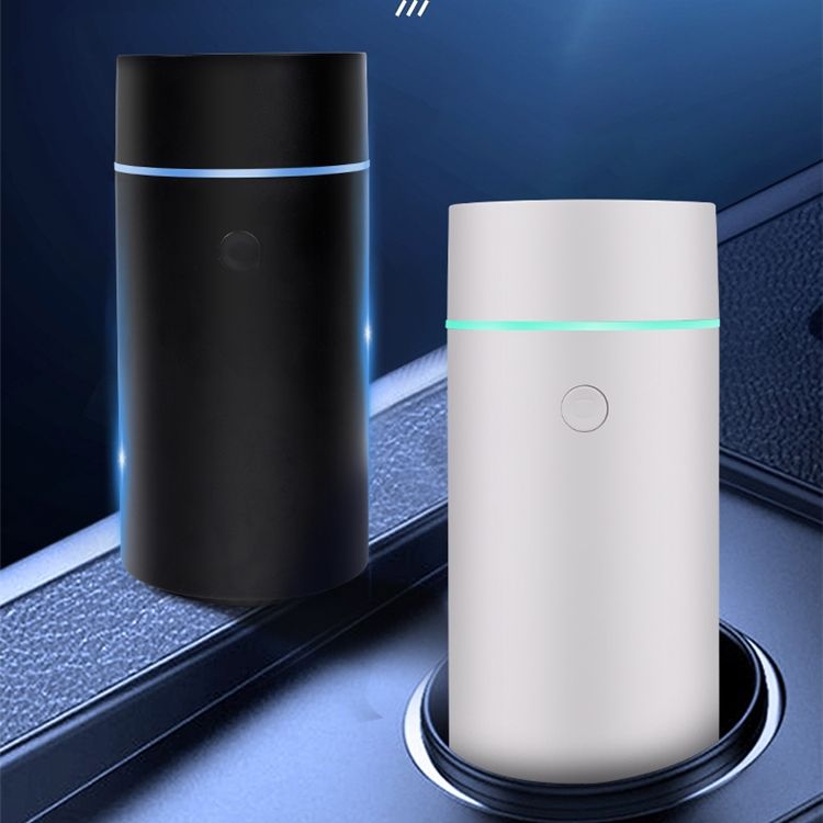 Black and white cylindrical devices with LED lights on a reflective surface.