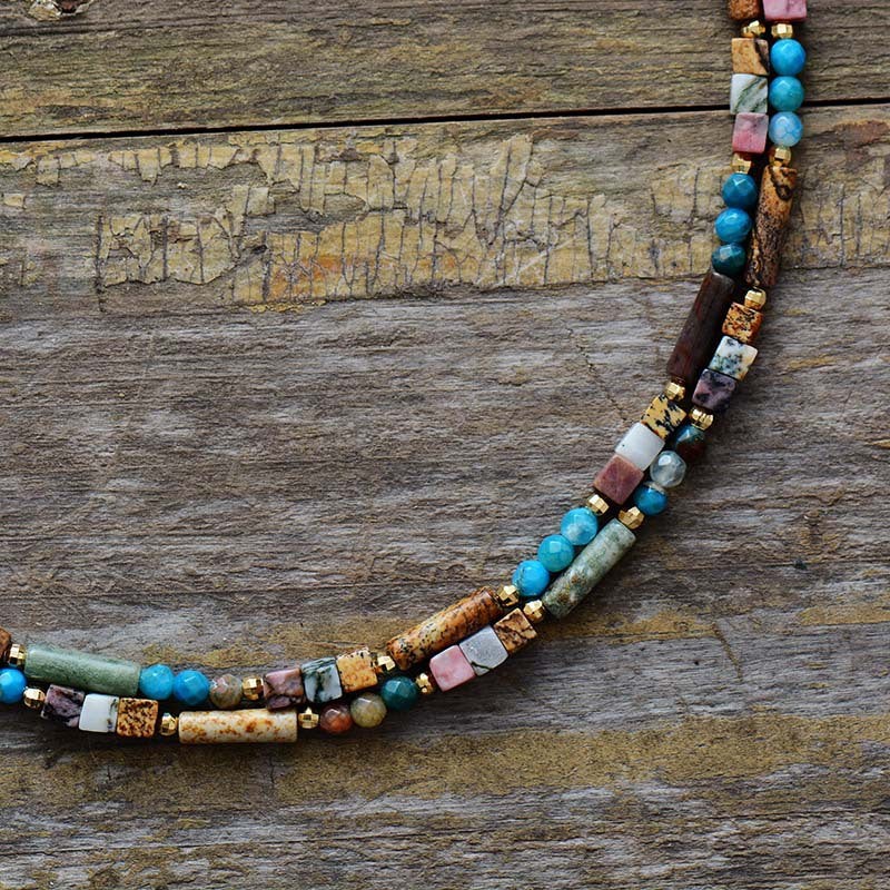 Multicolored beaded necklace on a wooden surface