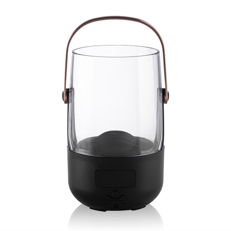 Black lantern-shaped device with a glass cover on a white background
