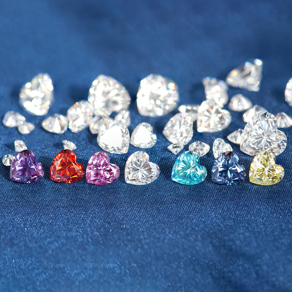 Assorted colored gemstones on a blue fabric background