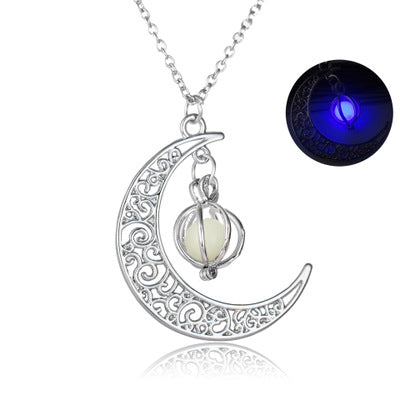 Silver crescent moon necklace with a glowing pendant on a white background