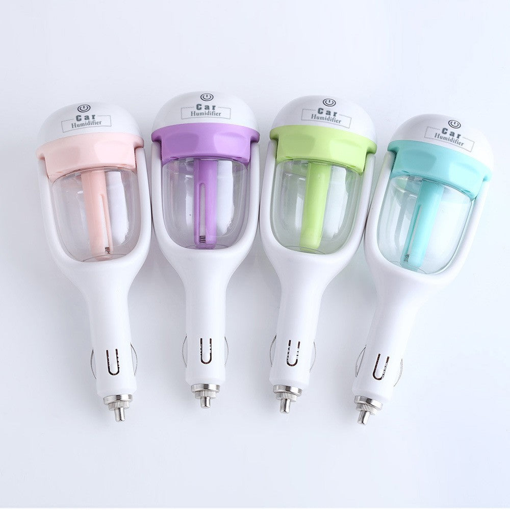 Four colorful car humidifiers with different colored nozzles on a white background