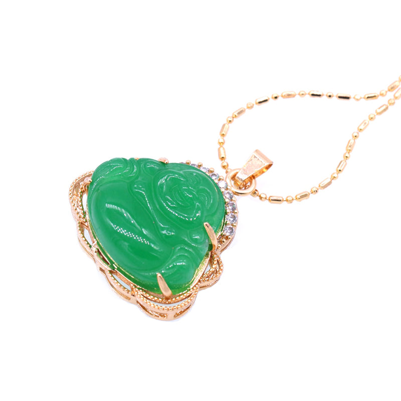 Green jade pendant with gold frame on a white background