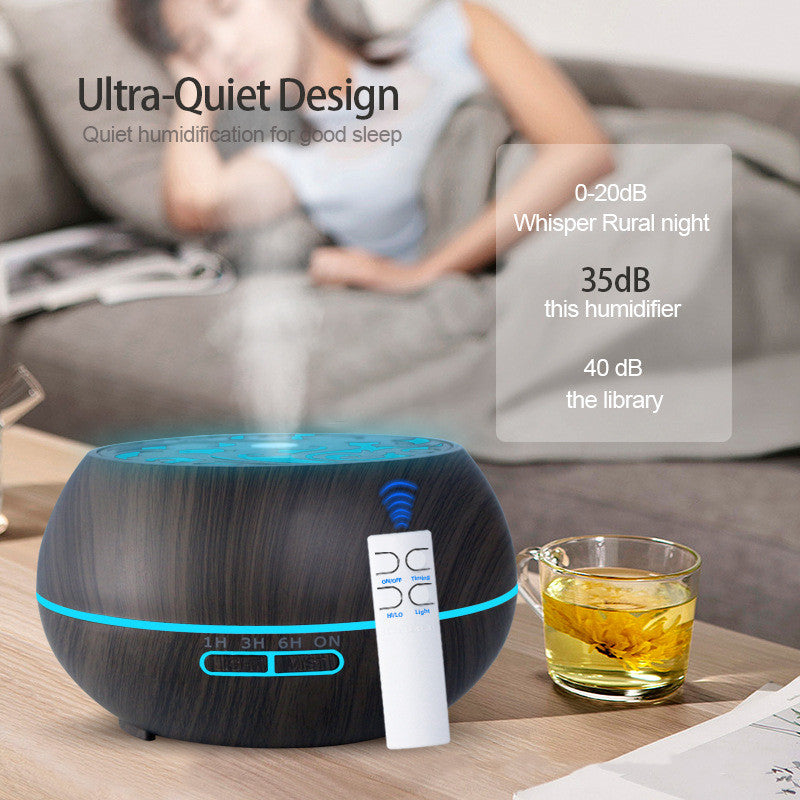 Humidifier on a table with a person sitting on a couch in the background