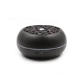 Black diffuser with intricate design on a white background