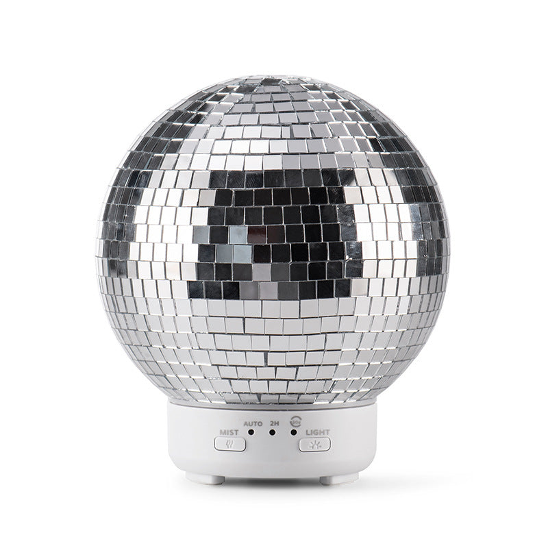 Silver disco ball with control panel on a white background