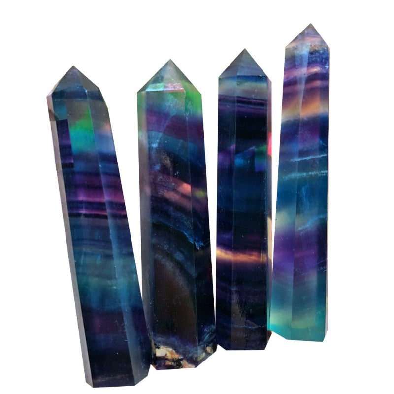 Four multicolored crystal points on a white background