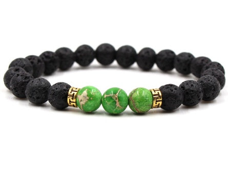 Black and green beaded bracelet on a white background