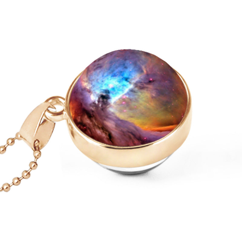 Nebula-themed pendant with gold chain on a white background