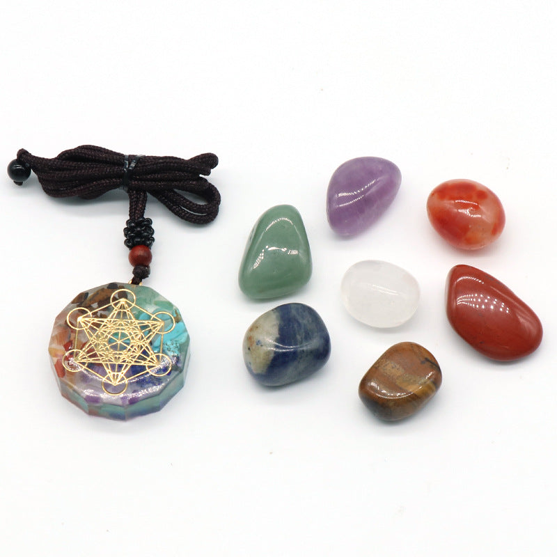 Necklace with a geometric pendant and surrounding stones on a white background