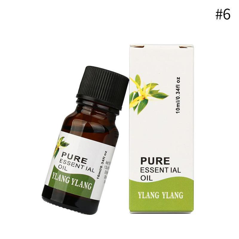 Ylang Ylang pure essential oil bottle and packaging on a white background