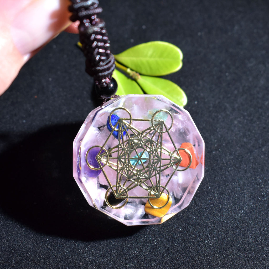Crystal pendant with geometric design on a black background