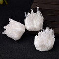 Three crystal formations on a dark surface
