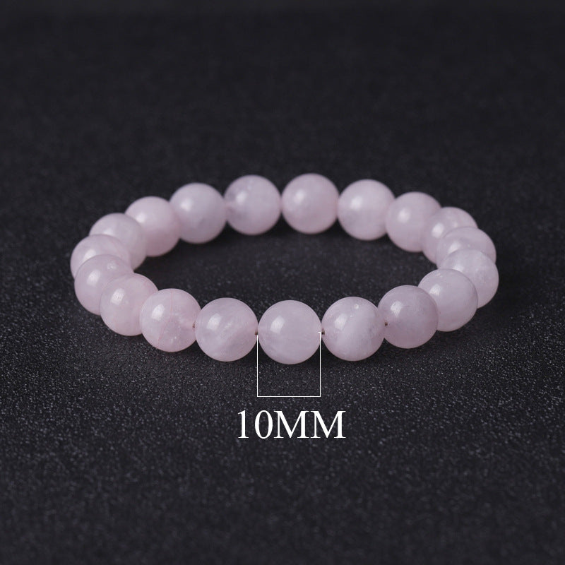 Pink beaded bracelet with '10MM' label on a dark background