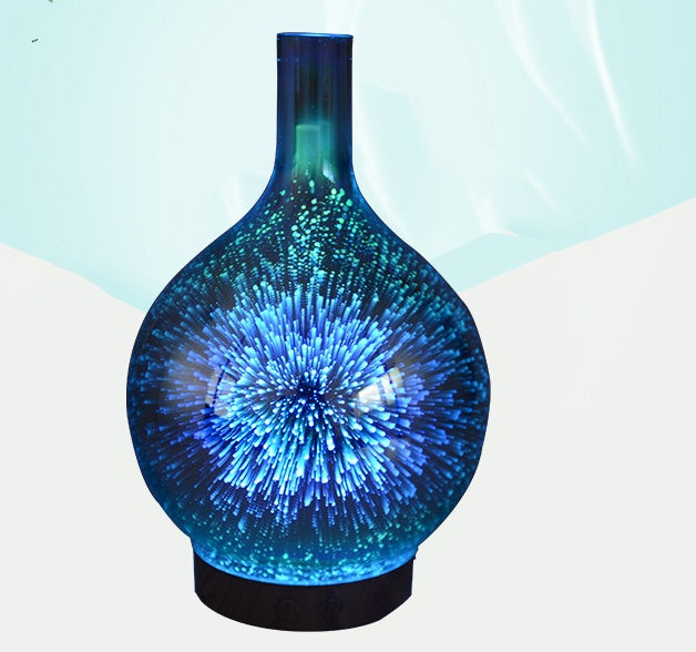 Blue glass vase with starburst pattern on a light blue background