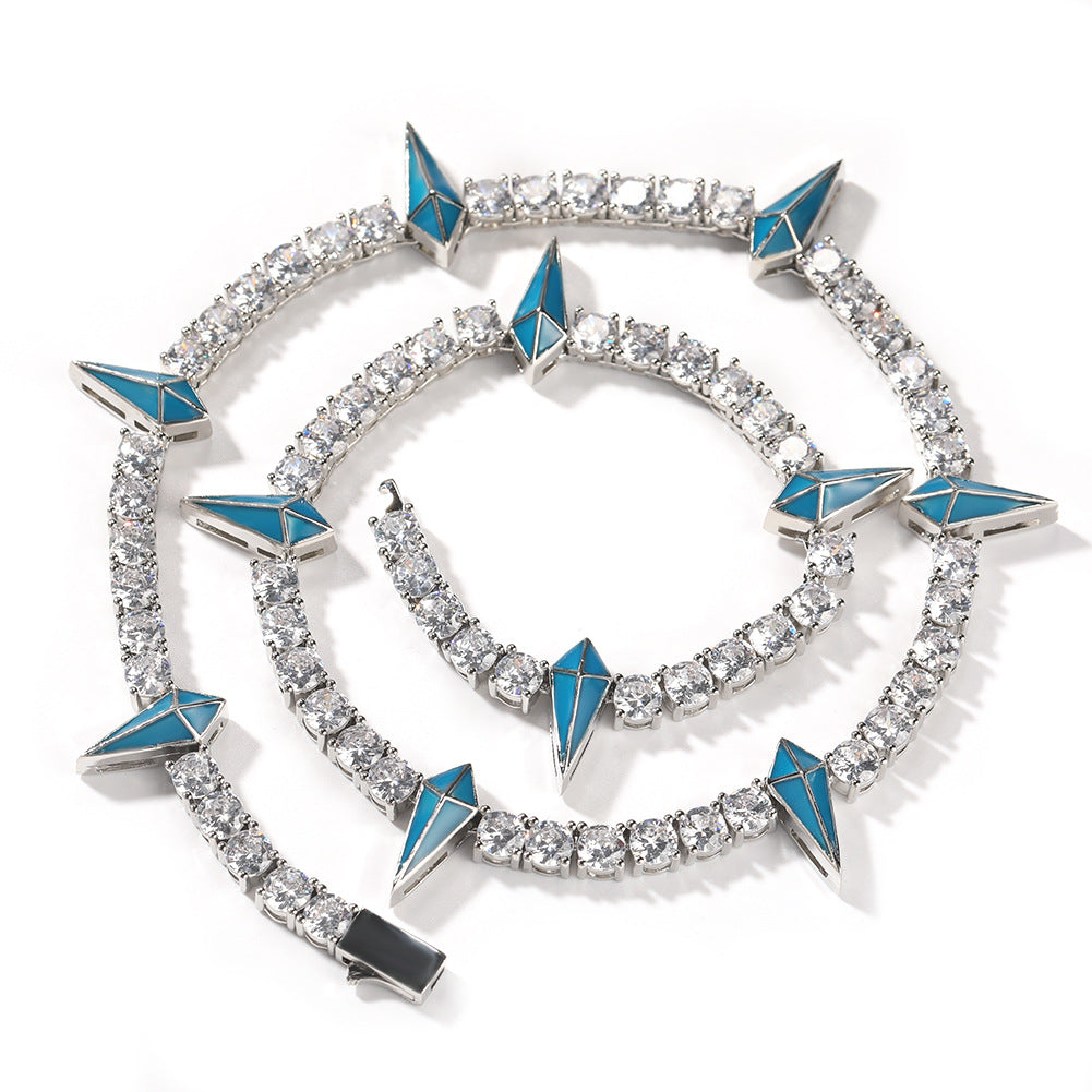 Bracelet with blue triangle accents and clear stones on a white background