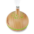 Wooden diffuser with green accents on a white background