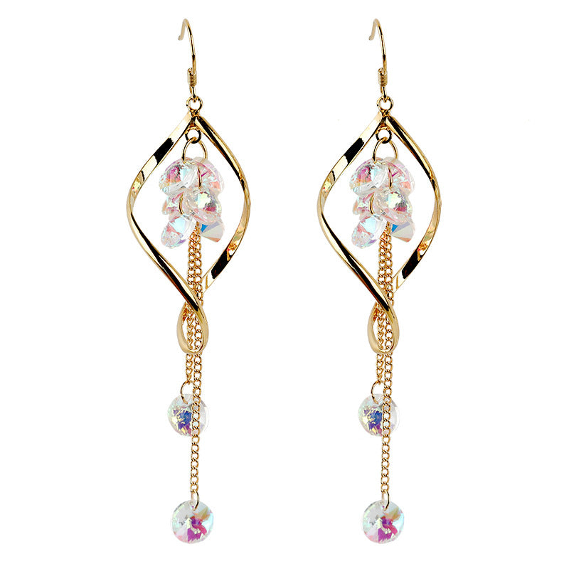 Gold earrings with colorful beads on a white background