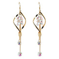 Gold earrings with colorful beads on a white background