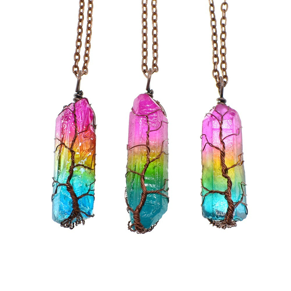 Colorful crystal pendant necklace with a tree design on a white background