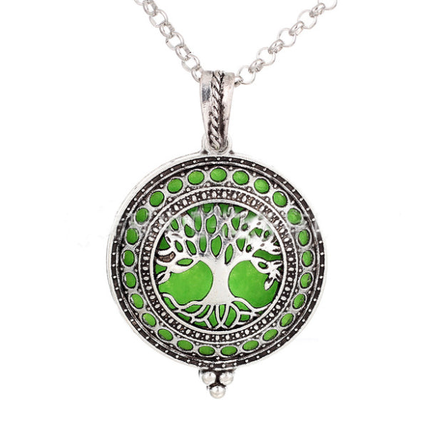 Necklace with a green tree of life pendant on a white background