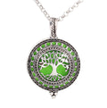 Necklace with a green tree of life pendant on a white background