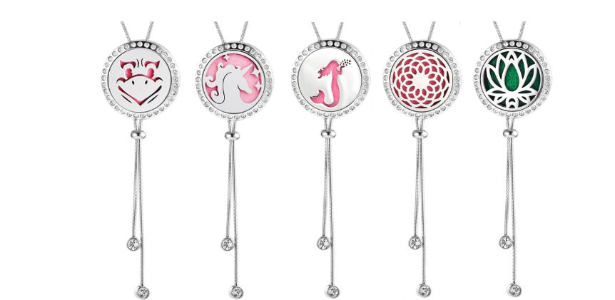 Five decorative sticks with circular ends featuring different designs on a white background