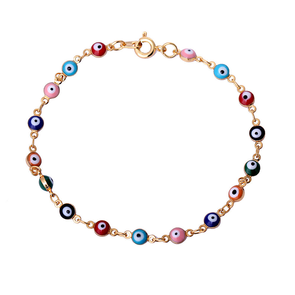 Bracelet with multicolored eye-shaped beads on a white background
