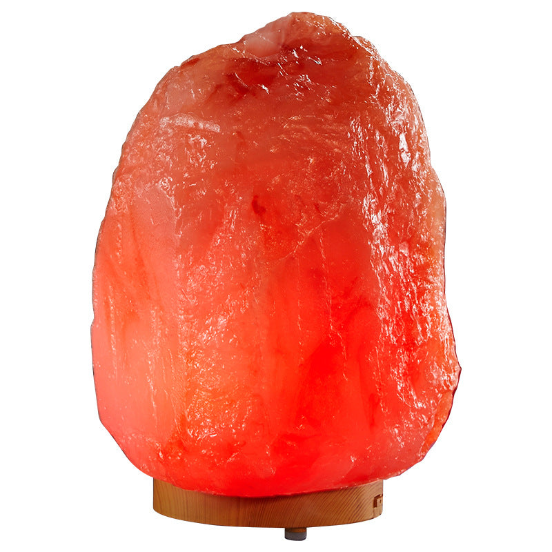 Himalayan salt lamp with a wooden base on a white background