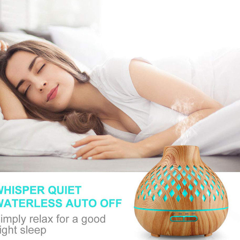 Woman lying in bed with a diffuser on a white background
