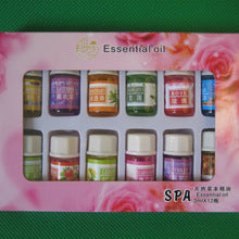 Set of essential oil bottles in a decorative box with floral design