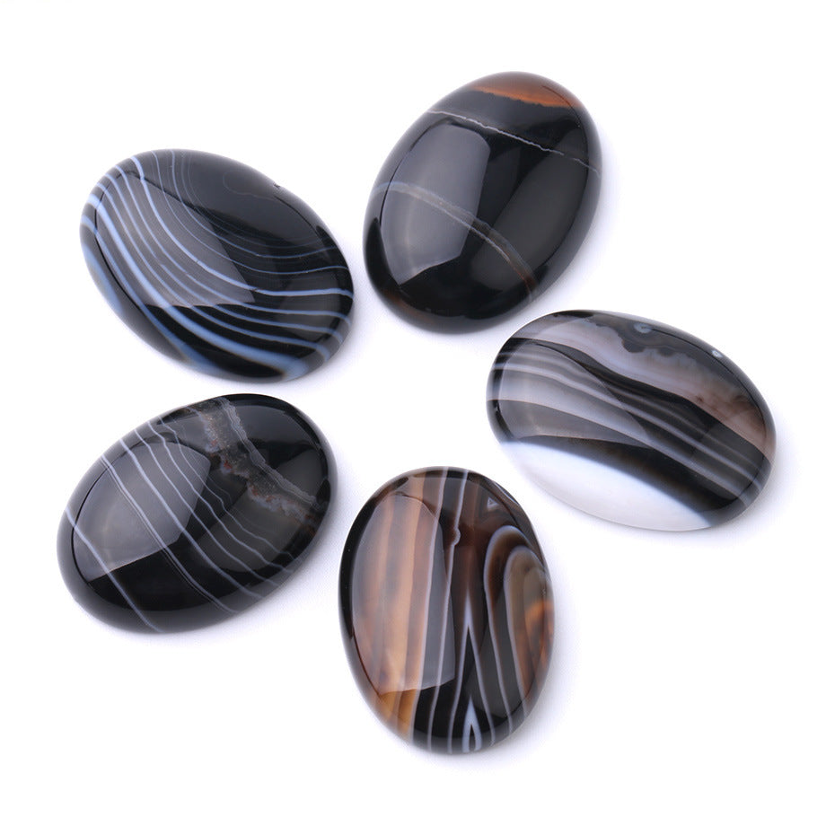 Five patterned stones on a white background
